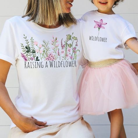 Customizable Mom and Daughter Tshirts. Note: Affiliate link Mom Daughter Tshirt Ideas, Green Wildflowers, Mini Outfits, Mother Daughter Shirts, 2023 Wishlist, Future Generation, Mini Outfit, Mom And Daughter Matching, Purple Wildflowers