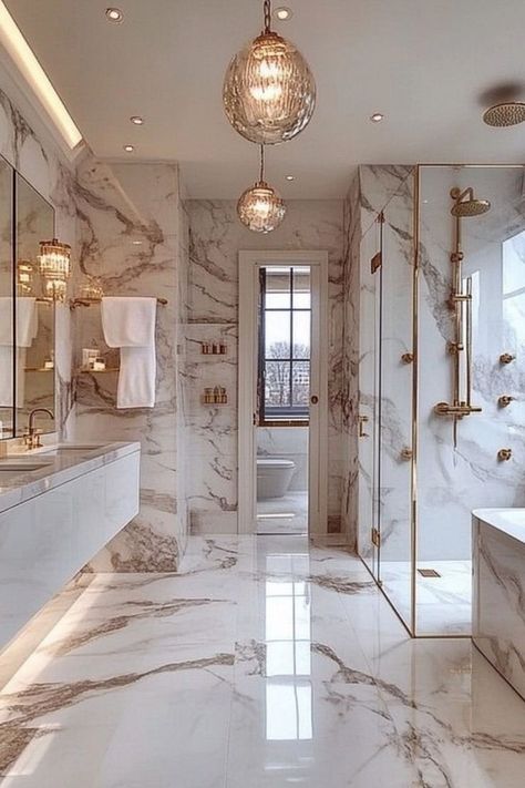 Design a modern glam bathroom with luxurious accents and stylish fixtures. #GlamBathroom #ModernDecor #LuxuryLiving Luxury Spa Like Bathroom, All White Marble Bathroom, Modern Mansion Interior Bathroom, Expensive Bathroom Aesthetic, Million Dollar Bathrooms Master Bath, Mansion Bathrooms Luxury, Modern Glam Bathroom Decor, Royal Bathroom Luxury, Elegant Master Bathrooms Luxury