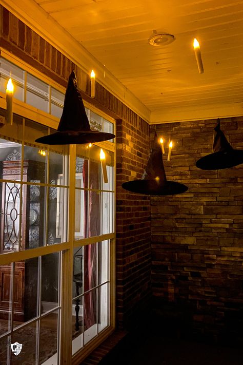 Decorate your front porch for Halloween with this clever Harry Potter inspired decorating idea. How to add floating LED candlesticks to your front porch for Halloween. Window Decor Ideas Halloween, Dot Halloween Decorations, Harry Potter Themed Halloween Decor Outdoor, Harry Potter Themed Front Porch, Hogwarts Halloween Decorations Outdoor, Harry Potter Halloween Porch Decorations, Harry Potter Party Halloween, Harry Potter Decorations Outdoor, Halloween Decor For Restaurant