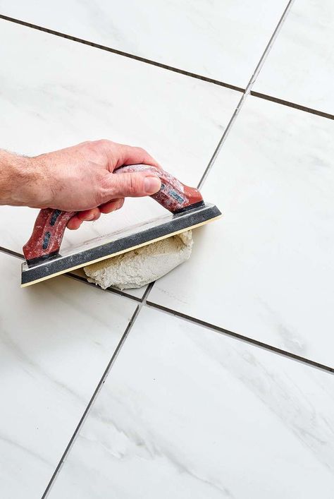 Grout is a necessary element of every tiled floor. Learn how to grout a tile floor and make it look perfect with this step-by-step guide. #homedecorideas #remodeltips #renovationideas #thespruce How To Grout Tile Floor, Tile Hacks, How To Grout, Floor Tile Grout, Floor Grout, Tiled Floor, Tile Table, Diy Tile, Tile Grout