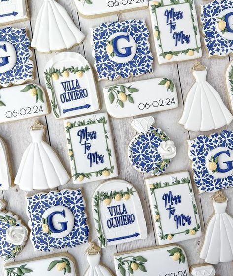 Lynn on Instagram: "Such a dreamy theme to work with. The blues and whites with the little pops of lemon yellow 😍 I am ready to pack my bags for Italy. Congratulations to the bride-to-be!   #italianbridalshower #lemonbridalshower #italianwedding #weddingcookies #bridalshowercookies #customcookies #cookieart #sugarcookiesofinstagram #decoratedcookies #bergencountynj #bergencounty #bergencountymoms #bergencountyeats #njcookies #pascackvalley #parkridgenj #njevents #njbride" Italian Tile Cookies, 2024 Cookies, Engagement Party Cookies, Italian Bridal Showers, Wedding Biscuit, Biscuit Ideas, Italian Themed Parties, Happy Ideas, Bridal Shower Desserts