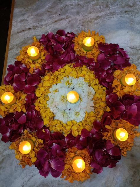 Real Flowers Rangoli Designs Ideas Easy, Simple Rangoli With Flowers Petals, Small Rangoli Design Flower, Rangoli Pics For Diwali, Gruhpravesh Rangoli Design, Real Flowers Rangoli Designs Ideas, Diwali Rangoli With Flowers And Diyas, Flower Rangoli With Diya, Diwali Rangoli Designs With Flowers