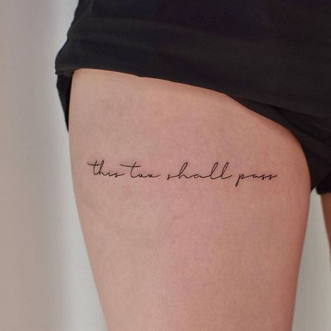 Frases para tatuajes | Tattoofilter Thigh Writting Tattoo, Text Tattoo On Thigh, Thigh Quotes Tattoos Women, This Too Shall Pass Quote Tattoo Rib, Tattoo On Thigh For Women Quote, Upper Knee Tattoo Women Quotes, Upper Thigh Quote Tattoo, Lettering Tattoo Ideas Women, This Shall Too Pass Tattoo