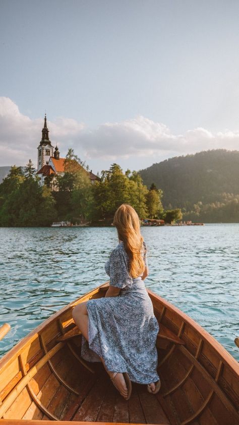 When you think of Slovenia, your first thought is probably of the iconic Lake Bled. Located less than an hours drive north of Ljubljana, as well as near the Julian Alps, Bled is very popular with tourists, and for good reason. Lake Bled is like something out of a fairytale, and there are plenty of activities to keep you busy. Here are the top things to do in Lake Bled. Boat Photoshoot, Lake Bled Slovenia, Lake Photoshoot, Bled Slovenia, Julian Alps, Lake Photography, Fairytale Fashion, Fairytale Photography, Travel Pictures Poses