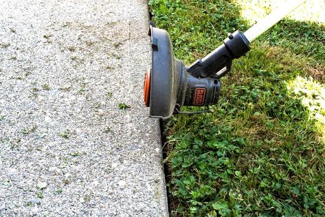 Twisting the head to become a grass edger, part of My newest weed trimmer which is a Black + Decker 20V String Trimmer / Edger LST201. And why I love it! funkyjunkinteriors.net How To Edge Lawn, Mowing Edge Border, Edge Trimmer Lawn, Preventing Weeds In Flower Beds, Garden Edger, Grass Edging, Lawn Edger, Hedge Trimmer Accessories, Flower Bed Edging