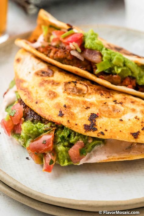 Smash Burger Tacos, aka Big Mac Tacos, combine a hamburger/chorizo patty with a flour tortilla and grill them until the tortilla is crispy. Top them with queso, guacamole, pico de gallo and spiced sour cream! Smash Tacos, Smash Burger Tacos, Big Mac Tacos, Mac Tacos, Taco Recipes Mexican, Burger Tacos, Taco Burger, Southwest Recipes, Flour Tortilla