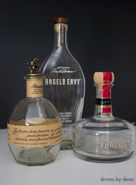 How To Remove Etching From Glassware, Bourbon Bottle Wedding Centerpieces, Work Centerpieces, Diy Flower Vases, Remove Paint From Glass, Whiskey Bottle Crafts, Liqour Bottles, Old Liquor Bottles, Empty Liquor Bottles