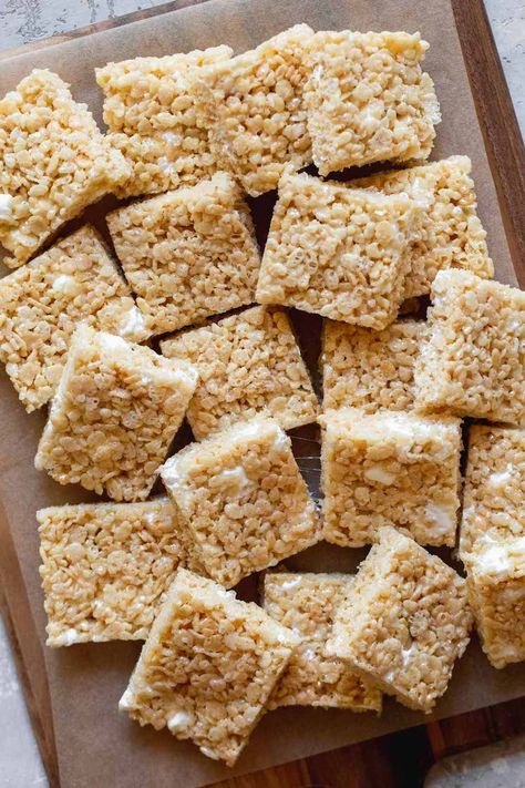 These Rice Krispie Treats are easy to make and use a full bag of marshmallows to get the perfect ratio of marshmallow to cereal. These bars are gooey and incredibly delicious! #ricekrispietreats #bars #dessert #recipe #livewellbakeoften Bars Dessert, Perfect Rice, Rice Krispie Treats, Rice Krispie, Dessert Recipe, Krispie Treats, Marshmallows, No Bake, Cereal