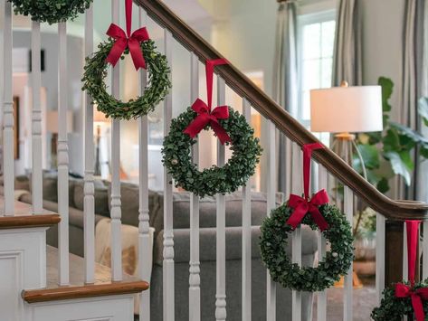 15 Christmas Staircase Decorating Ideas Staircase Wreath Ideas, Christmas Staircase Wreaths, How To Decorate Your Bannister For Christmas, Christmas Wreath On Stairs, Christmas Stocking Staircase, Christmas Wreath Staircase, Christmas Staircase No Garland, Garland At Base Of Stairs, Ribbon Staircase Christmas