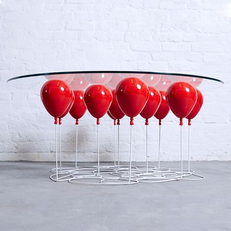 Colorful balloons appear to lift a glass tabletop into the air in the playful UP Balloon Table created by Duffy London (previously). The balloons are made of metal resin composite while the strings... Floating Balloons, Up Balloons, Unique Products Design, Deco Originale, Unique Coffee Table, Cool Tables, Glass Top Coffee Table, Style Deco, Red Balloon