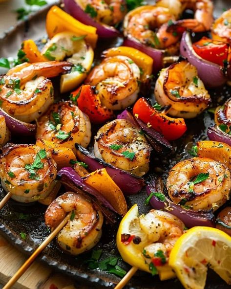 Grilling season is here! Kick it off with these mouth-watering Lemon Garlic Shrimp Skewers. Perfect for your next BBQ! Visit website for full recipe at https://northeastnosh.com/f/lemon-garlic-shrimp-skewers #northeastnosh #grilledshrimp #lemon #garlic #skewers #healthydinner #summercooking #grillseason #shrimpskewers #vegetableskewers #easyrecipes #weeknightdinner #seafoodrecipes #paleofriendly #glutenfree #dinnerideas #cookingathome #grilling #flavorful #homemade #freshingredients Shrimp Bbq Recipes Skewers, Shrimp Skewers Grill, Garlic Shrimp Skewers, Bbq Shrimp Skewers, Crunchy Food, Grilled Shrimp Skewers, Vegetable Skewers, Lemon Garlic Shrimp, Main Entrees