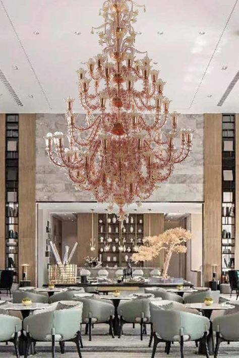 Elevate your interior with the Regale Rezzonico Murano glass chandelier. This handcrafted masterpiece features a golden structure adorned with intricate crystal and pink crystal elements, all enriched with 24Kt gold leaf. Its impressive size and detailed craftsmanship make it a stunning focal point in any space. Glass Chandeliers, Murano Chandelier, Murano Glass Chandelier, 24kt Gold, Metal Structure, Glass Chandelier, Glass Lighting, Pink Crystal, Intricate Designs