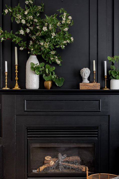 Dark Mantle Decor, Moody Fireplace Mantle Decor, Black Fireplace Styling, Painted Antique Fireplace Mantel, Black Mantle Decorating Ideas, How Wide Should A Fireplace Mantle Be, Dark Mantle Decorating Ideas, Black Fireplace Decor Ideas, Moody Mantle Decor