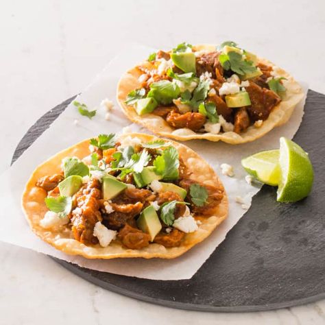 Spicy Mexican Shredded Pork Tostadas (Tinga) | Cook's Illustrated Recipe Mexican Shredded Pork, Pork Tostadas, Tostada Recipe, Tostadas Recipe, Cooks Illustrated Recipes, Gua Bao, Tostada Recipes, Barbecue Pulled Pork, Sweet Pork