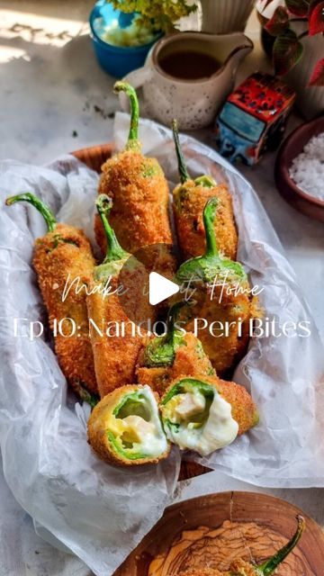 Rafia Mazhar on Instagram: "HERE'S HOW TO MAKE IT ⤵️ Make it at Home Episode 10: Nando's Peri Peri Bites 🌶 Chicken Filling 1 chicken breast in strips 2 tbsp peri peri sauce • Mix both ingredients and fry on medium heat till cooked Cheese Filling 2 tbsp shredded mozzarella cheese 2 tbsp shredded cheddar cheese 1 tbsp cream cheese 2 tbsp mayonnaise • Mix all the ingredients together fill in a piping bag Chillis 8 to 10 medium sized green chillies Water 1 tbsp vinegar Breading Flour Egg Breadcrumbs • Wash the chillies and dry. Make a T shaped incision on one side and remove all seeds from the inside (tap on the chillies to ensure all seeds are out) • Dip the chillies in a bowl of water and vinegar for 10 minutes • Remove the chillies. Dry with kitchen towel and fill each chilli Cooked Cheese, Chicken Strip, Peri Peri Sauce, Gastro Pub, Easy Snack Ideas, Easy Chicken Recipe, Pakora Recipes, Meal Plan Ideas, Peri Peri