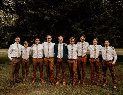 Rust Groomsmen Pants, Rust And Green Groomsmen, Tan Dress Pants Outfit Men Wedding, Dark Teal Mens Wedding Attire, Groomsman Brown Pants, Dark Khaki Groomsmen Attire, Groom Brown Pants, Khaki Pants Wedding Groomsmen, Green Jacket Brown Pants