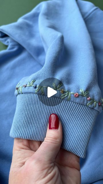 Jenny ~ Embroidery Art, Design & Crafts on Instagram: "I just love these little cuff details! What do you think? 💙 . . #upcycledclothing #upcycledfashion #knitwear #embroideredclothing #embroidereddenim #embroideredclothes #embroideredflorals #learntoembroider #mindfulart #slowstitching #sewingproject #embroiderypatterns #bordadolivre #createdtocreate #diycrafts #slowcraft #dmcthreads #dmcembroidery #springflowers #embroiderydesign #beginnerembroidery #embroiderywork #denimembroidery #sustainablefashion #embroiderhappyhoops #embroiderytutorial #embroideryprocess #embroideryproject #handsew" Embroidery On Sweatpants, Hand Embroidered Sweatshirt, Embroidery Pants, Learning To Embroider, Denim Embroidery, Hand Embroidery Design Patterns, Upcycled Fashion, Slow Stitching, Cuff Detail