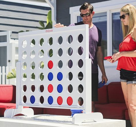 A massive 4 feet wide and 3.5 feet tall wooden version of the classic 4-in-a-row game we know and love. Giant Board Games, Connect Four Game, Giant Connect Four, Fun Backyard, Coin Games, 4 In A Row, Connect Four, Giant Games, Backyard Pools