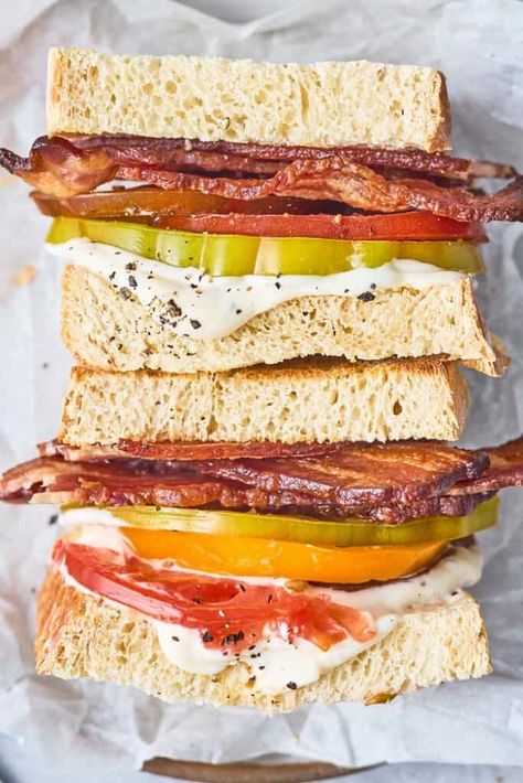 This Heirloom Tomato Sandwich is the perfect way to celebrate summer tomatoes, and don’t even think about skipping the lemony-garlic aioli, it’s necessary! Whether you serve it up BLT style or enjoy it in its simple summery form, this refreshing sandwich is bound to please!  #tomatosandwich #sandwich #tomato #tomatoes Tomato Sandwich Recipes, Homemade Tomato Basil Soup, Quick Salads, Southern Recipes Soul Food, Tomato Tart, Bacon Tomato, Vegan Mayonnaise, Tomato Sandwich, Heirloom Tomato