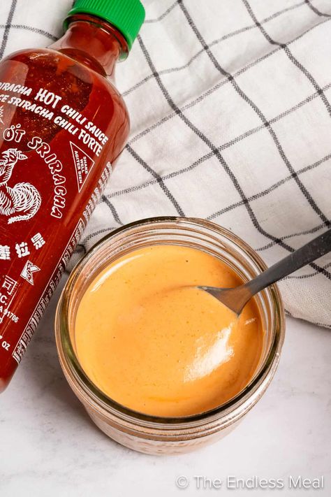 As far as condiments go, sriracha mayo has become quite the staple in our fridge: it's the perfect duo of creamy richness from the mayonnaise and the fiery kick from sriracha sauce. This flavor-packed condiment adds a zing to everything, from french fries to sandwiches and even sushi! #theendlessmeal #sriracha #siracha #srirachamayo #mayo #dippingsauce #dip #frysauce How To Make Sriracha Mayo, Sriracha Mayo Recipe, Sriracha Recipes, Sweet Potato Rolls, Baked Potato Salad, Sriracha Mayo, Sushi Bowl, Fry Sauce, Marinade Sauce