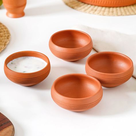 Crafted by nature, designed for your home! 🤎 Introducing our terracotta dining collection where the farmhouse meets finesse. Bring the warmth of the earth to every meal with this exquisite tableware. ✨🤌🏻 Products featured: 1. Engraved Terracotta Dinner Plates Set Of 4 9 Inch 2. Set Of 4 Earthen Terracotta Snack Plates 7 Inch 3. Ring Engraved Terracotta Dessert Bowls Set Of 4 250ml 4. Set Of 4 Earthen Clay Terracotta Small Bowls 150ml 5. Bengal Clay Terracotta Large Serving Bowls Set Of 2 70... Terra Cotta Plates, Terracota Ceramic Plate Setting, Terracotta Trinket Dish, Daily Wear Terracotta Jewellery, Teracota Bowls, Serving Bowl Set, Green Lifestyle, Snack Plate, Snack Bowls