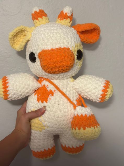 An adorable candy corn themed cow, perfect for halloween and spooky season. The cow is 18 inches tall and 9 inches wide. He's ready for his new home! Crochet Halloween Stuff, Fall Crochet Animals, Crocheted Items, Pumpkin Cow Crochet Pattern, Crochet Ideas Halloween, Crochet Halloween Plushies, Crochet Tennessee Vols, Halloween Crochet Stuffed Animals, Halloween Cow Crochet