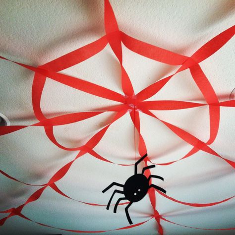 made this spider web out of streamers for a Spider-Man themed birthday party!!  even a good idea for a halloween party, just use black streamers!! :D Jungle Halloween, Halloween Ceiling, Paper Spider, Hanging Spider, Spiderman Decorations, Spider Decorations, Spiderman Theme, Halloween Idea, Spiderman Birthday Party