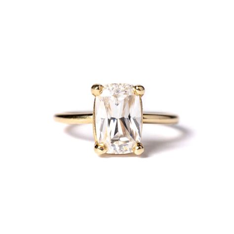 Shaleigh: an antique-inspired beauty featuring an elongated cushion cut Moissanite as its centerpiece. With its vintage charm and timeless elegance, this ring is sure to captivate. * 2.5ct Elongated Cushion Cut Moissanite 10x5.5mm * G-H Nearly Colorless * Basket Setting * Smooth 1.5mm Band * 14k Recycled Yellow Gold $3,490 starting monthly with Affirm $121 #moissanite #moissaniteengagementring #moissanitering #engagementring #jewelry #moissanitejewelry #rings #diamonds #ring Elongated Cushion Ring, Elongated Cushion Cut Engagement Ring, Organic Engagement Rings, Cushion Cut Moissanite Engagement Ring, Hexagon Engagement Ring, Moissanite Engagement Ring Cushion Cut, Hammered Wedding Bands, Elongated Cushion Cut, Marquise Diamond Engagement Ring