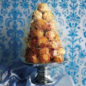 I made this once! It was a pain in the ars but so pretty. I had spun sugar burns all over my arms!!!!   croquebouche Croquembouche Recipe, French Wedding Cakes, Traditional French Desserts, Creme Puff, Profiterole, Christmas Baking Recipes, Delicious Magazine, Choux Pastry, French Dessert