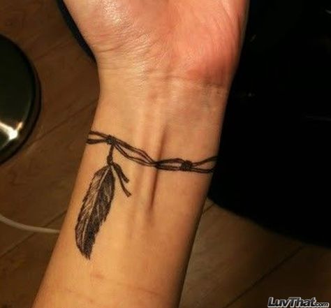 feather on a string wrist tattoo Armband Tattoo Frau, Wrist Tattoos Girls, Band Tattoo Designs, Armband Tattoo Design, Feather Tattoo Design, Anklet Tattoos, Wrist Tattoos For Guys, Arm Band Tattoo, Small Wrist Tattoos