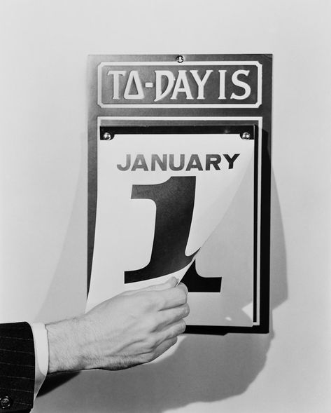 A man's hand tearing January 1 page off of daily wall calendar, circa 1930s Mans Hand, New Years Eve Traditions, Marathon Training Plan, Calendar Date, Male Hands, New Years Day, Photo Puzzle, January 1, Wall Calendar