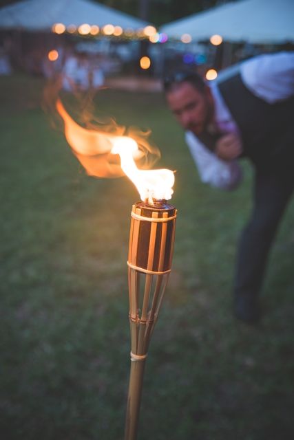 Tiki Torch aisle Tulum Party, Fire Torch, Outdoor Torches, Rustic Beach Wedding, River Rat, Olympic Torch, Wedding Arbour, Tiki Torches, Wedding Entrance