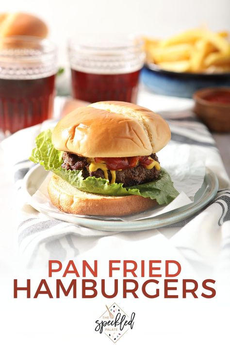 Want a burger but can’t fire up the grill? These Skillet Hamburgers, cooked on the stovetop, make the perfect dinner, no matter the time of year! Learn how easy it is to pan fry hamburgers. #EasyEntertaining #SpeckledPalate Pan Hamburgers, Fried Hamburger Patties, Pan Fried Burgers, Skillet Hamburgers, Pan Fried Hamburgers, The Best Hamburgers, Best Hamburgers, Best Hamburger Patty Recipe, Pan Burgers