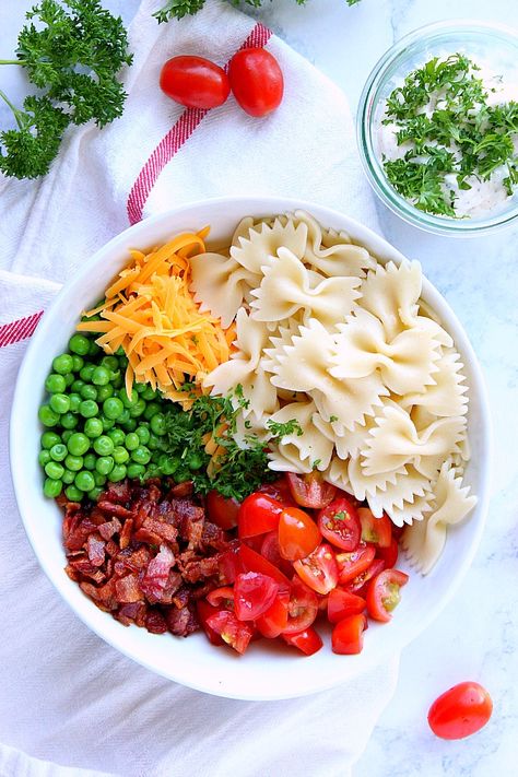 Bacon Ranch Pasta Salad Recipe - bow tie pasta, bacon, cheddar, tomatoes and peas with creamy Ranch dressing make this salad an easy and delicious side dish! Pasta Salad Bacon, Pasta Salad Ranch Dressing, Suddenly Pasta Salad, Pasta Bacon, Pasta Salad For Kids, Salad Recipes With Bacon, Bowtie Pasta Salad, Bacon Ranch Pasta, Healthy Breakfast Bowl