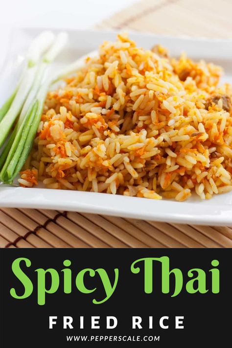 This spicy Thai fried rice recipe is delicious as a side to most any Thai meal, but it’s hearty enough to eat as a meal in its own right. We use steak here, but you can sub in shrimp just as easily. #spicythaifriedricerecipe #spicythairecipesfriedrice #spicythaifriedrice #thaifriedrice #spicyfriedrice #friedrice #friedricerecipe Thai Fried Rice Recipe Spicy, Thai Rice Recipes, Thai Vegetable Fried Rice, Thai Fried Rice Recipe, Spicy Rice Recipe, Rice Casseroles, Savoury Rice, Pancit Recipe, Thai Fried Rice