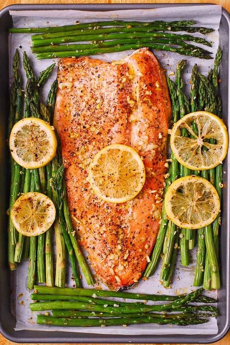 BAKED RAINBOW TROUT WITH LEMON, BLACK PEPPER, AND GARLI Rainbow Trout Recipe Baked, Baked Rainbow Trout, Trout Fillet Recipes, Baked Trout, Trout Recipe, Trout Recipes, Baked Asparagus, Salmon And Asparagus, Fish Dinner