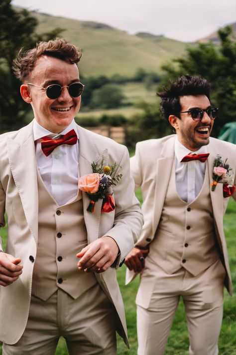 Groom Suit With Bow Tie, Tan Suit With Red Tie, Suit Bow Tie, Tan Suit With Burnt Orange Tie, Tan Suit Red Tie, Groom Suit Red, Wedding Suits Men Terracotta, Tan Suit With Terracotta Tie, Red And Orange Wedding Groomsmen