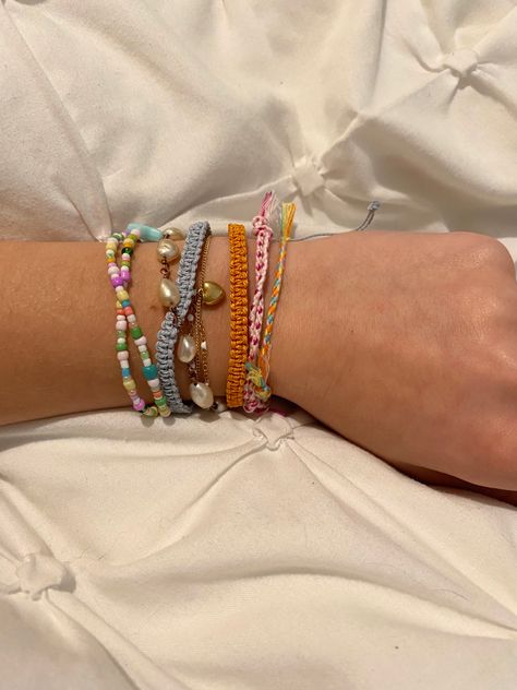 Colorful Bracelet Stack, Diy Bracelet Stacks, Friendship Bracelet Aesthetic, Bracelet Stack Summer, Friendship Bracelet Stack, Summer Bracelet Stack, Bracelet Stack Ideas, Yarn Bracelets, Bracelet Stacks