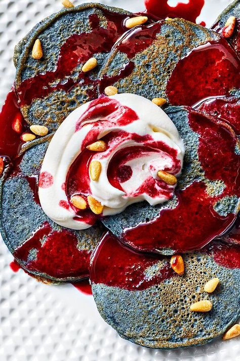 Earthy, savory blue corn brings a vibrant hue to these silver dollar pancakes. Drizzled with sweet, tart, smoky blackberry-piloncillo syrup and dolloped with tangy whipped crema, these pancakes are fruity, not too sweet, and filled with flavor.#dessertrecipes #dessertideas #dessertdishes #sweettreats Blue Cornmeal Pancakes, Blue Corn Pancakes, Blue Cornmeal, Banana Blueberry Pancakes, Colorful Breakfast, Corn Pancakes, Pancake Recipes, Blue Corn, Seasonal Recipes