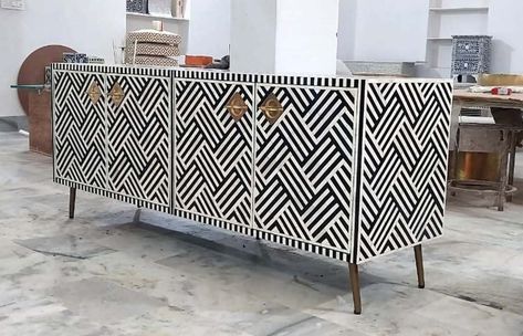 "Product Description: Handmade Decorative Bone-Inlay \"Media TV Cabinet\". Handcrafted Bone inlay is a decorative technique that consists of inserting small pieces of \"Camel/Buffalo Bone\" and \"Mother of pearl\" into a beautiful pattern. These patterns are used on a variety of home decor furniture products such Dressers, Desk, End Table, Side Table, Night Stand, Console, Vanity, work Desk, Enter way, Side boards, Mirror Frames, Photo Frames, Chairs, Tea/Coffee Table, Study Desk, Storage Unit, Bone Inlay Console, Console Vanity, Side Boards, Cabinet Buffet, Foyer Ideas, Table Study, Royal Palaces, Mario Bellini, Media Cabinet