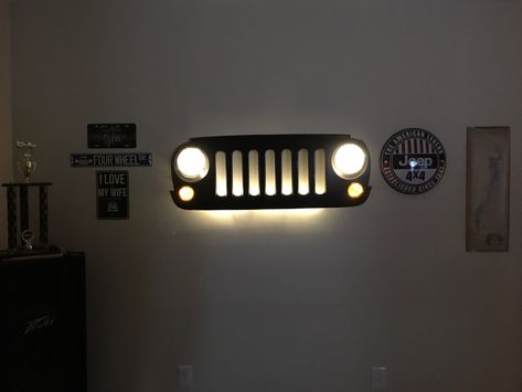 Repurposed Jeep grill head lights and turn signals laced with fairy lights Jeep Grill Decor, Jeep Wrangler Grill, Grill Wall, Jeep Decor, Grill Ideas, Grill Light, Jeep Grill, Baby Boy Bedroom, Boys Bedroom Decor