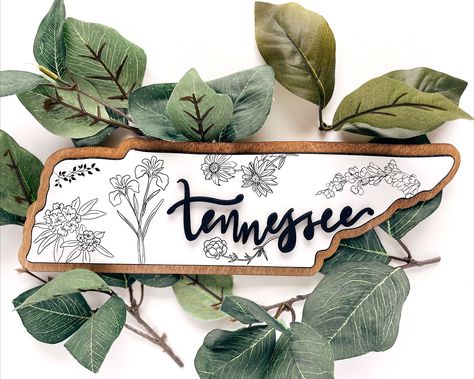 Tennessee wood wall art is a beautiful and unique way to show your love for the Volunteer State. This hand-crafted piece features a map of Tennessee with the state flowers, making it the perfect gift for any Tennessean or fan of the state.

#Tennessee #WoodWallArt #MapOfTennessee #StateFlowers Craft Building Ideas, Map Of Tennessee, Pumpkin Signs, Alaska Cabin, Laser Cut Wall Decor, Gifts For New Homeowners, House Warming Gift Ideas, Laser Business, Diy Laser Engraver