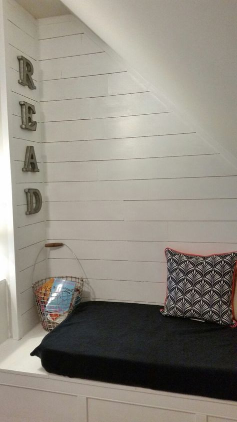 Reading nook with shiplap. Perfect for our awkward,  sloped wall space. Storage Decor Ideas, Ideas Under Stairs, The Space Under The Stairs, Sloped Wall, Bed Under Stairs, Relaxation Corner, Space Under The Stairs, Under Stairs Nook, Homeschool Room Design