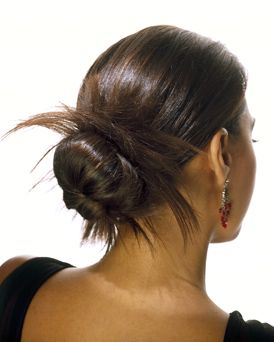 This bun is low-slung but fun, with spiky strands going this way and that.  www.whirlastyle.com Her Hair, A Woman, Hairstyles, Hair, Black