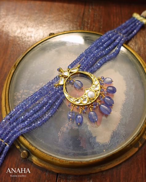 Tanzanite is an extraordinary gemstone, renowned for its ability to display different colors when viewed from various angles. It has long been one of our favorite gemstones, especially when paired with classic Chandbalis-inspired chokers. The design features intricate floral motifs, with faceted tanzanites adding a touch of brilliant color, creating a truly beautiful and distinctive piece. • • • • • • #anahakundanjewelry #simrangosal #bridesofindia #bridaljewellery #weddinginspiration ... Gold Jewelry Outfits, Beads Collection, Tanzanite Jewelry, Heritage Jewellery, Art Deco Bracelet, Beads Jewellery, Royal Jewelry, Kundan Jewellery, Floral Motifs