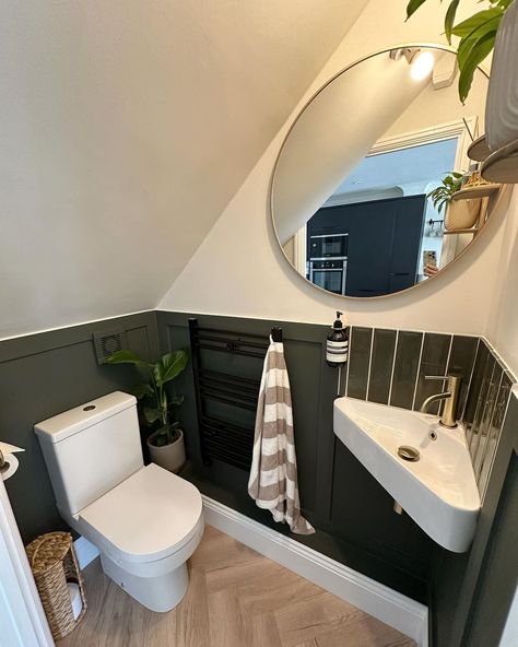 Tips to making a small downstairs bathroom come to life 🌿⁠
@kjhomespace⁠
⁠
1. Add panelling to give the room more definition⁠
2. Darker paint always is a fun idea in a small space⁠
3. A large mirror to give the illusion of a bigger space⁠
4. Corner sink to take up less room⁠
5. Adding different textures (tiles, paint, shelves, plants) to complete the interior ✨⁠
⁠
Swipe to see before 🤯⁠
⁠
#bathroom #smallbathroomideas #howtodecorate #interior #smallspace  #bathroomrenovation Tiny Bathroom Sloped Ceiling, Under Stairs Loo Downstairs Toilet, Panelled Small Bathroom, Downstairs Toilet Corner Sink, Corner Sink Bathroom Mirror, Small Bathroom Ideas Under Stairs, Tiny Corner Sink, Powder Room With Corner Sink, Attic Half Bathroom