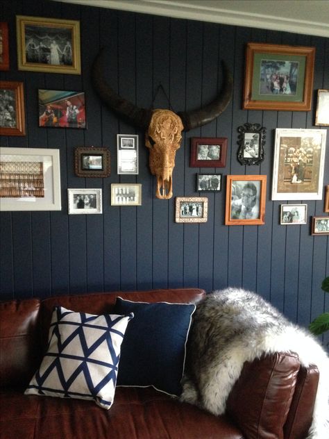 Skull Gallery Wall, Navy Western Bedroom, Western Lounge Room, Navy Blue Western Bedroom, Blue Western Living Room, Western Game Room, Blue Rustic Living Room, Moody Western Living Room, Blue Western Bedroom