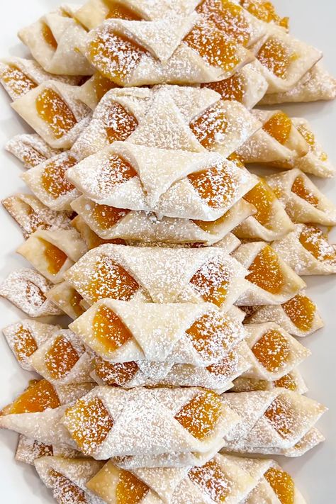 Easy apricot jam-filled kolaczki (or kolacky) are Polish cookies filled with delectable jam and topped with powdered sugar. They're very simple to make and so much fun to eat! #kolaczki #kolacky #polishcookies Kolaczki Cookies, Kolache Cookies, Polish Pastries, Easy Kolacky Cookies, Kolacky Cookies Recipes, Apricot Pillow Cookies, Polish Kolaczki Cookies, Kolachi Cookies, Kalochky Cookies