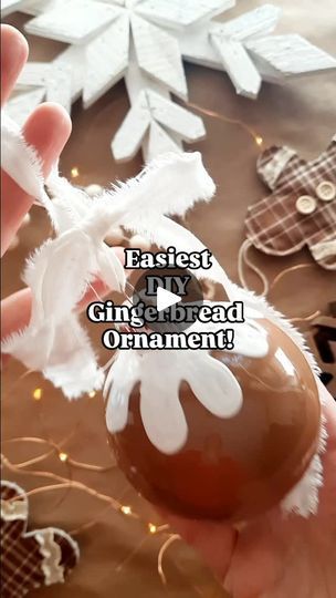 3K views · 893 reactions | Having trouble finding neutral gingerbread ornament balls? Use my DIY!

Create your own adorable gingerbread ornaments with this easy 4-step tutorial:

Paint the inside of clear ornaments with a warm, cookie-inspired hue
Add faux icing details with white puff paint
Allow 24 hours to dry
Top with a rustic fabric bow (simply rip tattered strips!)

Voilà! Instant gingerbread charm for your tree!
NOTE ***keep checking ornaments as they dry to cover back up any streaking that might happen***

Need the exact supply list? Comment "materials" below!

Follow along for handmade home decor inspiration, DIY tutorials, and more!  And stay tuned to see my gingerbread tree reveal soon!

P.S. I made those plaid gingerbread ornaments in the background.  They’re in my Etsy shop! C Christmas Gingerbread Ornaments, Diy Gingerbread Christmas Tree Decorations, Diy Brown Ornaments, Gingerbread Diy Ornaments, Gingerbread Ornaments On Tree, Diy Gingerbread Ornaments Tree Decorations, Gingerbread Cookie Ornaments Diy, Diy Gingerbread Ornaments, Gingerbread Ornaments Diy