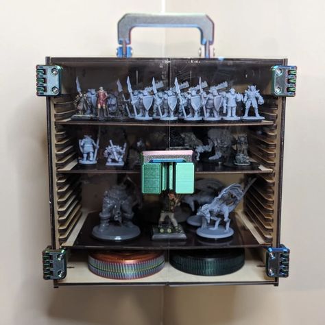 Planning a massive tabletop battle??? Mini storage, display, and carrier case! 🐉😈👺👹🤖🙀🧚🧞🧝🧙🧛🧟🧌 Each shelf can store up to 88 medium size minis! Comes with 4 shelves with a magnetic base to lock the minis onto. It also has optional cleats for storing on the wall. This current version is designed to hang in the corner, but a flat version will be released soon! *Assembly required* #tabletopgames #d&d #dnd #warhammer #warhammercommunity #dndminiatures #miniature #dnd5e #dndminis #dndminiatu... Dnd Warhammer, Dnd Minis, Corner Display, Dnd Miniatures, Mini Storage, Mini Accessories, Storage Display, In The Corner, Adjustable Shelf